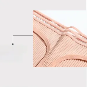 Detail of ribbed cotton thong with triple-strap hollow waistband design in pink