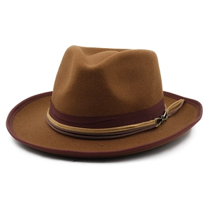 Close-up of brown wool felt fedora featuring a vintage ribbon and metal buckle detail