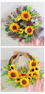 Detail of sunflower wreath with bee decor, green leaves, and rustic burlap bow