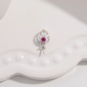 Macro detail of S925 sterling silver hollow flower pendant with a pink zircon stone