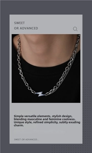 Double-layered silver necklace with blue lightning bolt pendant and zircon accent