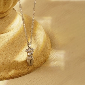 French vintage silver stainless steel Venus torso pendant necklace on stone base