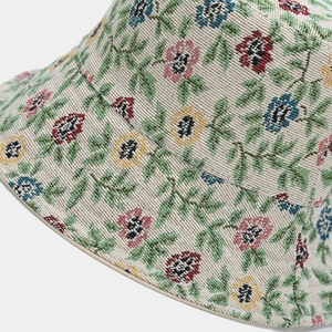 Detailed macro view of retro floral jacquard texture on a women fisherman hat