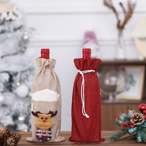 Burlap Christmas wine bottle covers with reindeer applique and festive holiday decor