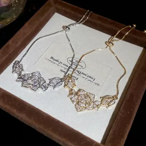 Elegant gold and silver rose flower bracelets with sparkling zircons and adjustable clasp