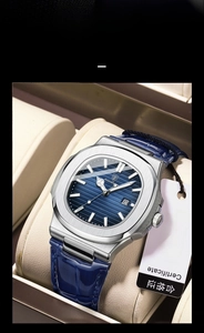 Detailed close-up of blue textured dial and steel bezel of an ultra-thin quartz watch