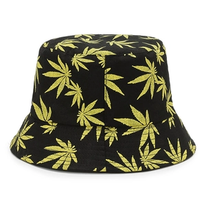 Tie-dye bucket hat featuring yellow maple leaf print on a black cotton canvas base