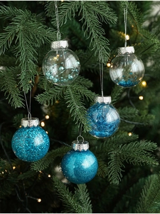 Close-up of 6cm blue Christmas balls with glitter and sequins hanging on a festive pine tree