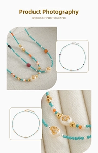 Close-up of handmade bohemian beaded necklace with baroque pearls and turquoise stones