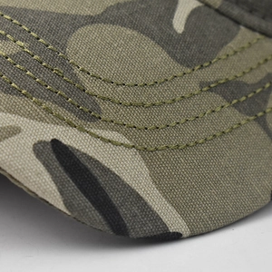Macro detail of camouflage baseball cap showing stitching and durable twill fabric texture