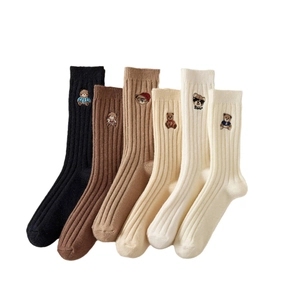 Six pairs of ribbed crew socks featuring cute bear embroidery in earthy neutral tones