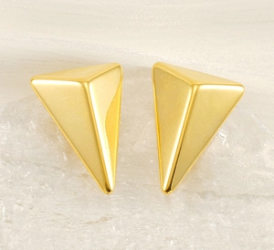 Macro shot of 18K gold plated stainless steel 3D triangular pyramid stud earrings