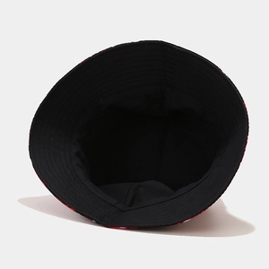 Interior view of black bucket hat with red floral brim pattern and sturdy cotton lining