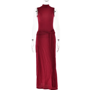 Close-up of red sleeveless maxi dress with shiny lurex fabric and waist knot detail