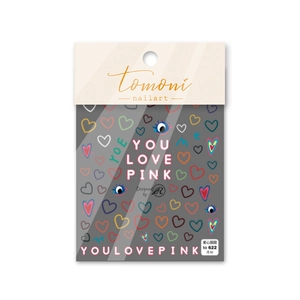Detail shot of nail art stickers with colorful hand-drawn hearts and blue eye patterns