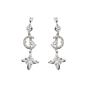 Elegant silver tassel earrings featuring sparkling star and moon designs with rhinestones