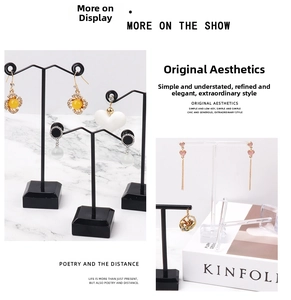 Detail view of colorful floral and heart earrings on T-bar and acrylic display stands