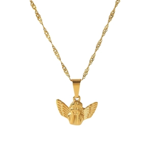 Gold angel pendant necklace with twisted chain on white background, retro style jewelry