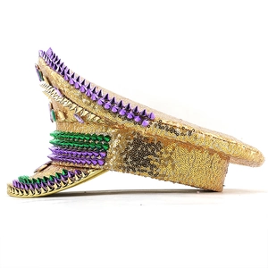 Detailed side view of a gold sequin captain hat with purple and green rhinestones and studs