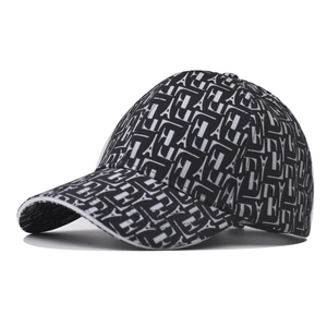 Detailed view of fashionable black and white lattice baseball cap with L letter pattern