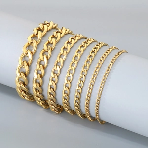 18K gold-plated stainless steel Cuban link bracelets in various widths on grey display