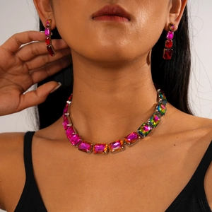 Detail of rainbow gradient rectangle crystal necklace and matching earrings set