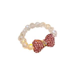Sparkling crystal beaded ring with a sweet pink rhinestone bow pendant on white background