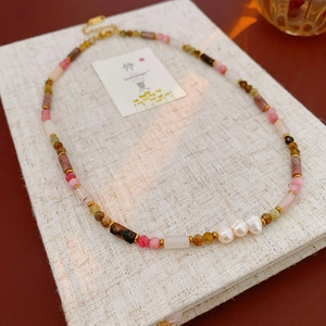 Detail view of bamboo-style necklace with pink crystals and freshwater pearls