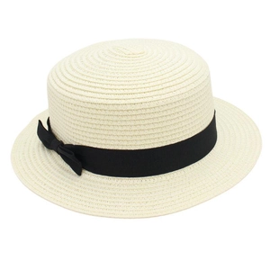 Detailed top view of a flat top straw boater hat with a black grosgrain ribbon bow