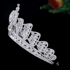 Detailed side view of silver bridal crown with crystal leaf and floral patterns