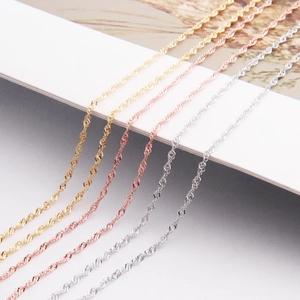 Macro view of wave chain textures in gold, rose gold and silver sterling silver finishes