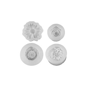 Set of 4 white silicone flower molds for DIY candles featuring rose and sunflower textures