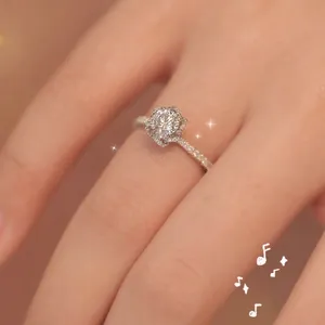 Elegant round brilliant cut diamond engagement ring with micro-pave setting on silver band