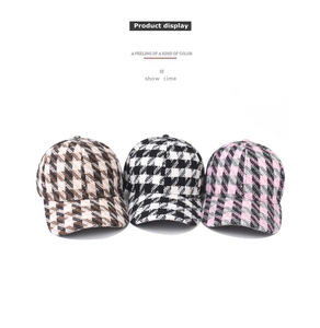 Three thick plaid baseball caps in brown, black, and pink with woven texture detail