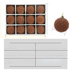 Macro shot of dark brown flocked Christmas balls with assorted embossed textures in a box