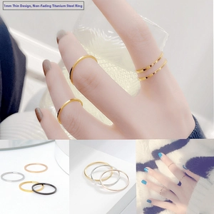 Close-up of 1mm minimalist titanium steel rings in gold, silver, rose gold and black