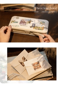 Detail showing vintage travel scenery stickers set in a white metal tin box and envelopes