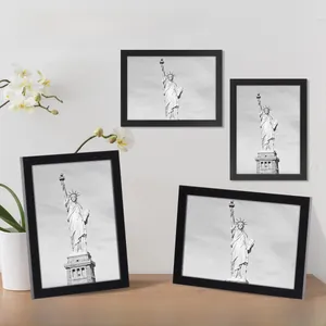 Modern black wooden photo frame display for wall hanging or tabletop with floral decor