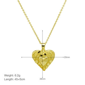 Detail showing 20mm x 26mm textured heart pendant with dimensions and weight specs