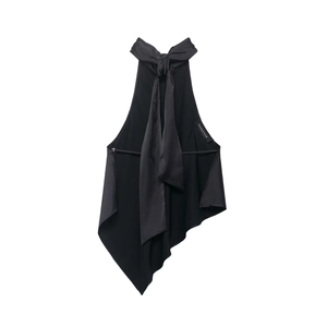 Detail of black halter top featuring satin texture, backless cut and side brand label