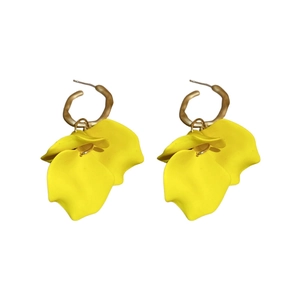 Elegant gold earrings featuring yellow acrylic petals in a studio setting on white background