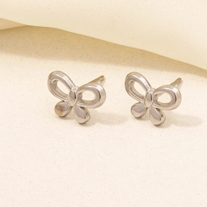 Close-up of elegant silver bow-knot stud earrings in polished 304 stainless steel