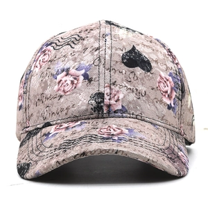 Detailed view of grey lace baseball cap with rose patterns and Vintage print