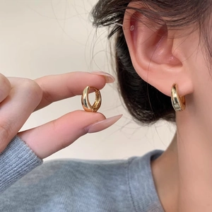 Polished gold drop hoop earrings in minimalist water droplet design for women