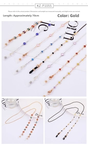 Detail of 70cm gold multipurpose chain with crystal butterflies and daisy pendants