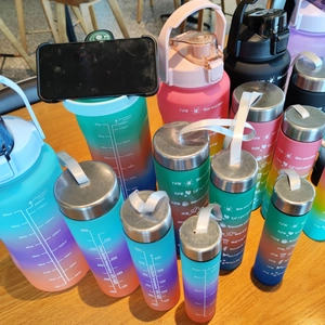4-piece gradient frosted water bottle set with time markers and straw 64oz 32oz