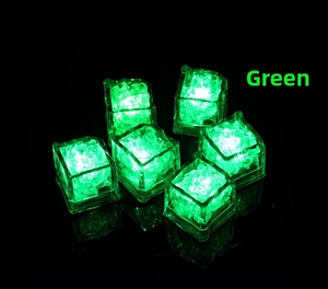 Close-up of six green LED glowing ice cubes with reflections on a dark surface