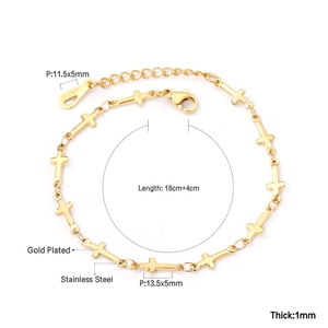 Detailed view of gold plated stainless steel cross chain bracelet with 18KGP engraving