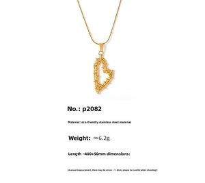 Detailed shot of PVD gold plated stainless steel heart pendant with intricate texture