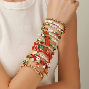 Set of 12 Christmas bracelets featuring Santa motifs and festive colorful beaded layers